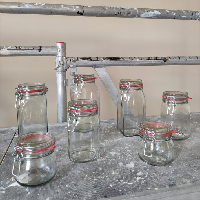 bundle of clip-top jars in industrial setting