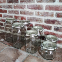 Load image into Gallery viewer, View from angle of the cliptop jars with a brick background
