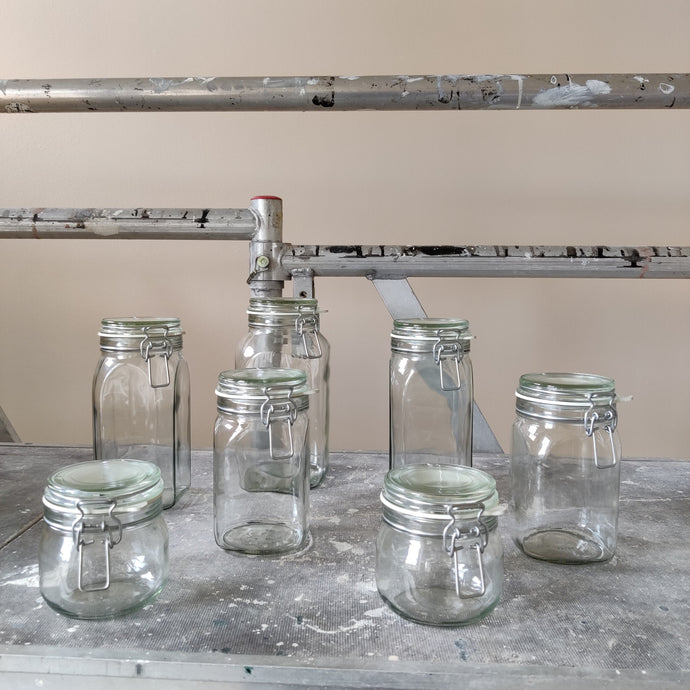 Clip-top jars in industrial background